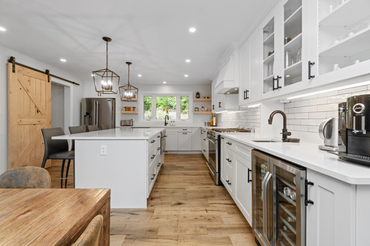 Gourmet kitchen with large island and gas range at Casa Muzyka Lakehouse, Barry's Bay